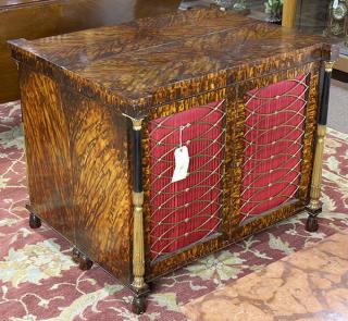 Appraisal: Pair of Regency style faux tortoiseshell console cabinets Pair of