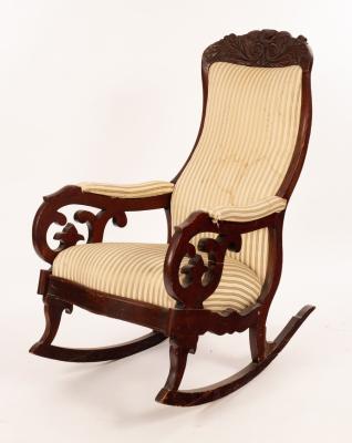 Appraisal: A th Century carved and stained beech armchair with scroll