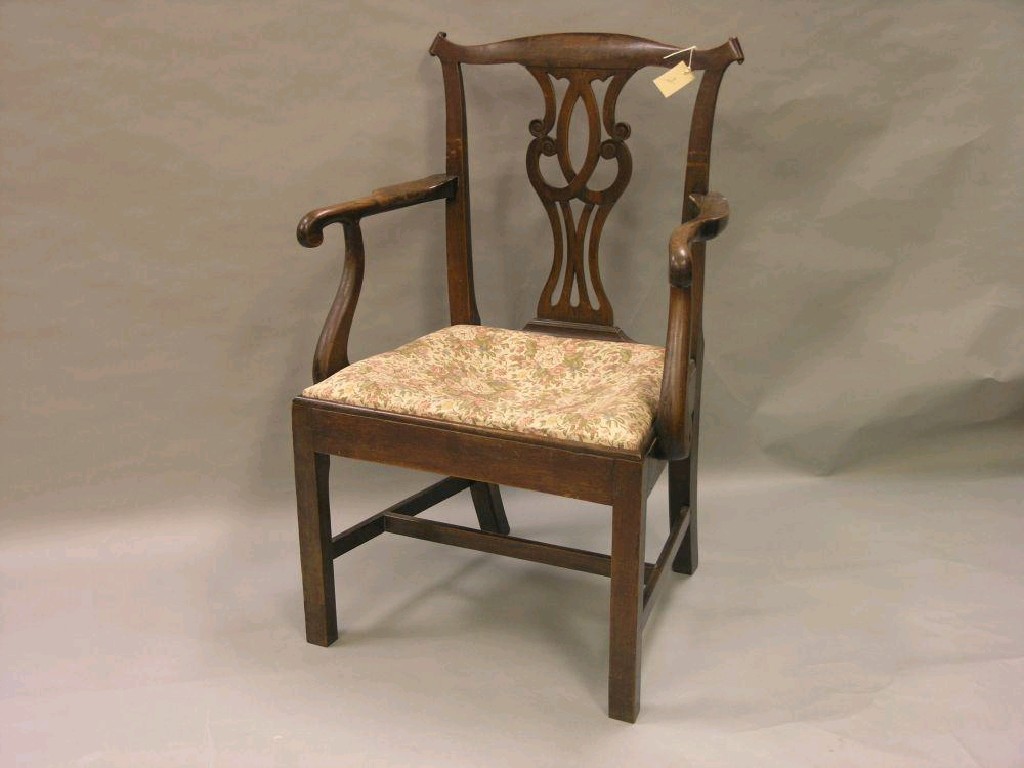 Appraisal: A George III mahogany carver chair interlaced splat above drop-in