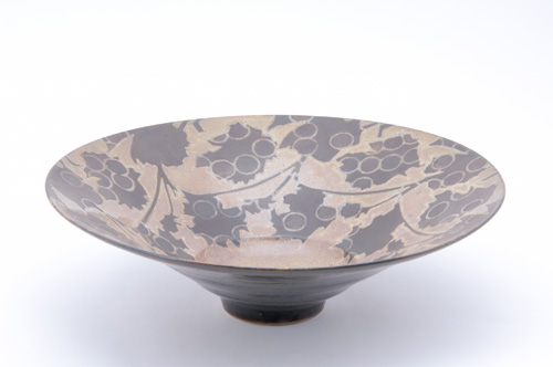 Appraisal: SUTTON TAYLOR Earthenware flaring center bowl decorated in a grapevine