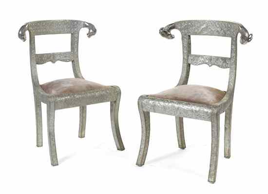 Appraisal: A Near Pair of Eastern Silvered Metal-Clad Side Chairs each