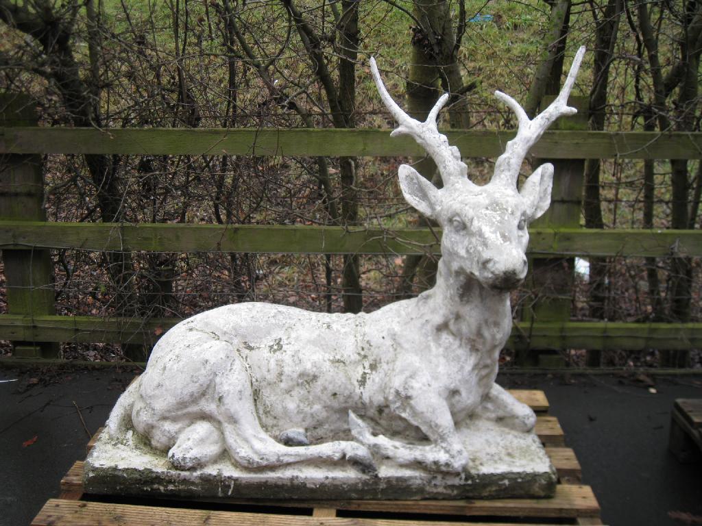 Appraisal: A composite stone reclining Stag close to life size