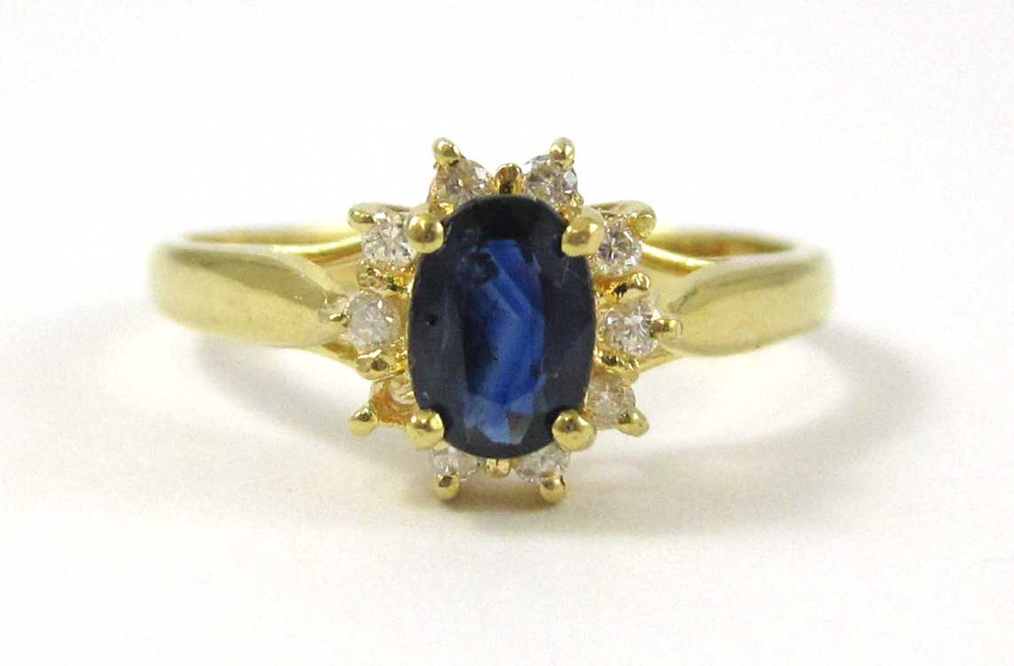 Appraisal: SAPPHIRE DIAMOND AND EIGHTEEN KARAT GOLD RING with nine round-cut