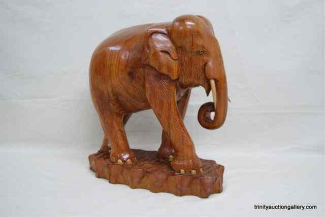 Appraisal: Large Hand Carved Wooden Elephant SculptureCreated from a large solid