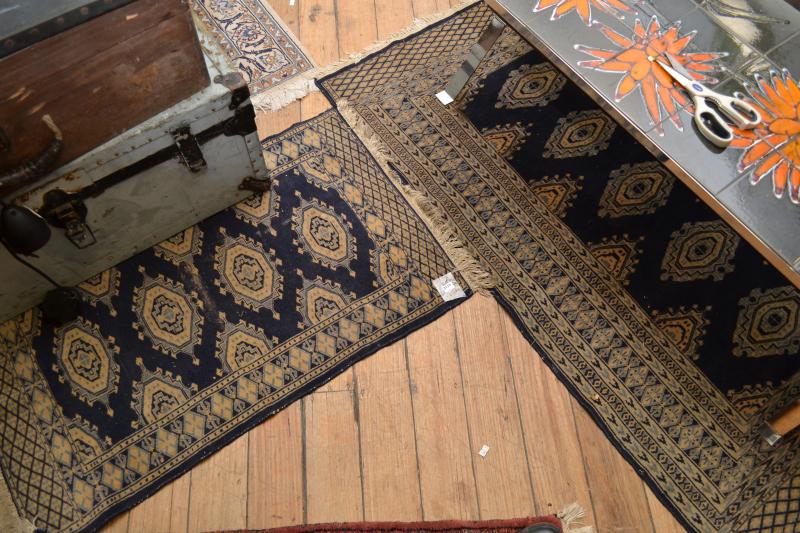 Appraisal: TWO SIMILAR RUGS IN BLUE AND CREAM TONES TWO SIMILAR