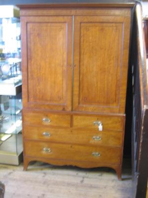 Appraisal: A REGENCY MAHOGANY LINEN PRESS crossbanded with ebony stringing cavetto