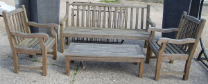 Appraisal: A good quality weathered teak garden set by Britannic Teak