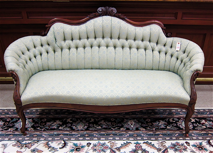 Appraisal: VICTORIAN STYLE SERPENTINE-BACK SOFA American late th early th century