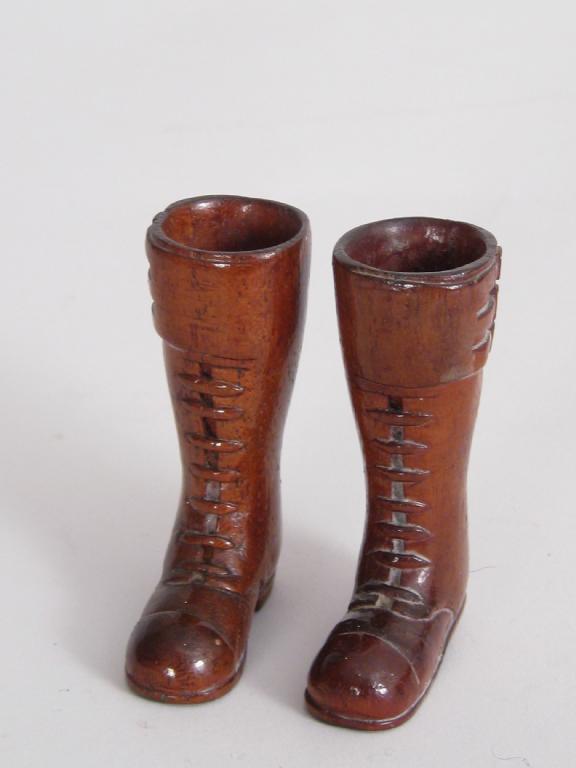 Appraisal: Pair of miniature treen Motor-cycle Boots in and matching Helmet