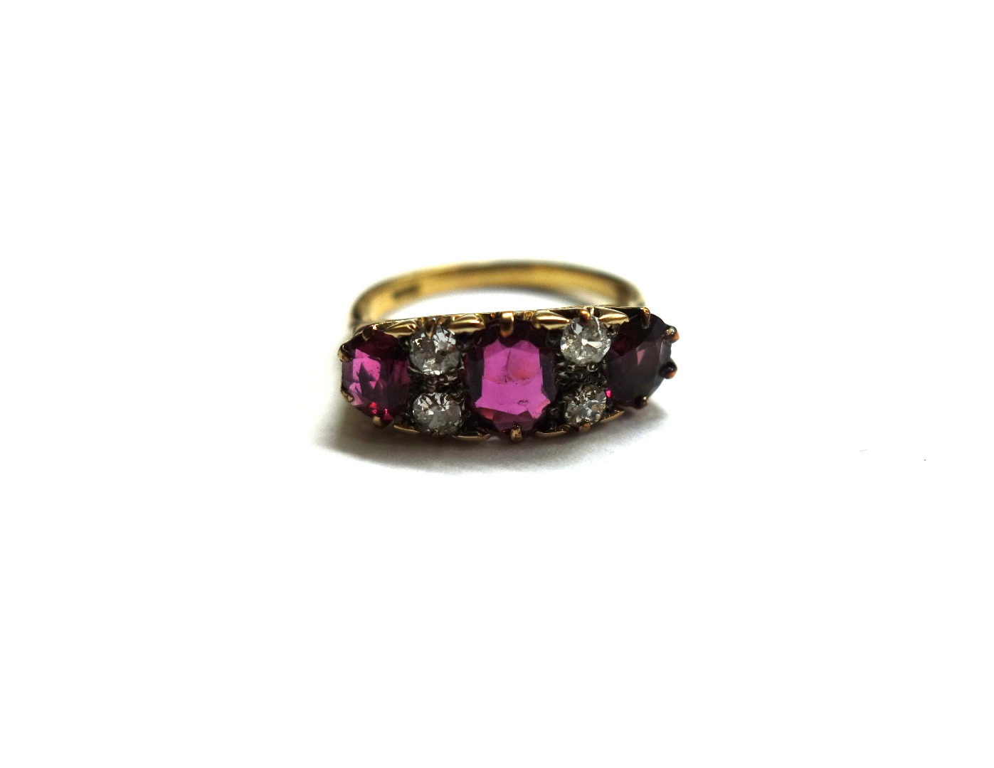 Appraisal: An early th century gold ruby garnet and diamond carved