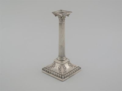 Appraisal: A George III taperstick with a Corinthian column detachable nozzle