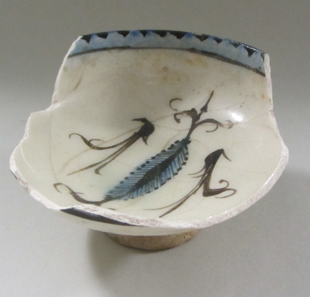 Appraisal: A small Kashan pottery bowl painted in the centre in