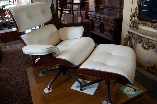 Appraisal: EAMES STYLE WHITE UPHOLSTERED LOUNGE CHAIR WITH MATCHING OTTOMAN