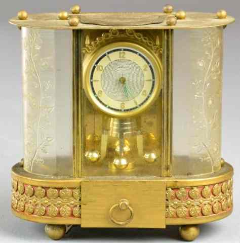 Appraisal: Musical Clock by SchmidOblong musical brass clock with jewels -day