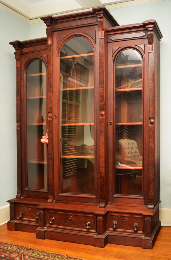 Appraisal: TRIPLE FRONT VICTORIAN BOOKCASE CABINET Bookcase in sections pediments with