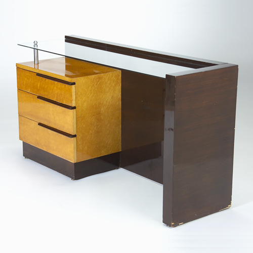 Appraisal: GILBERT ROHDE HERMAN MILLER Vanity in contrasting woods with plate