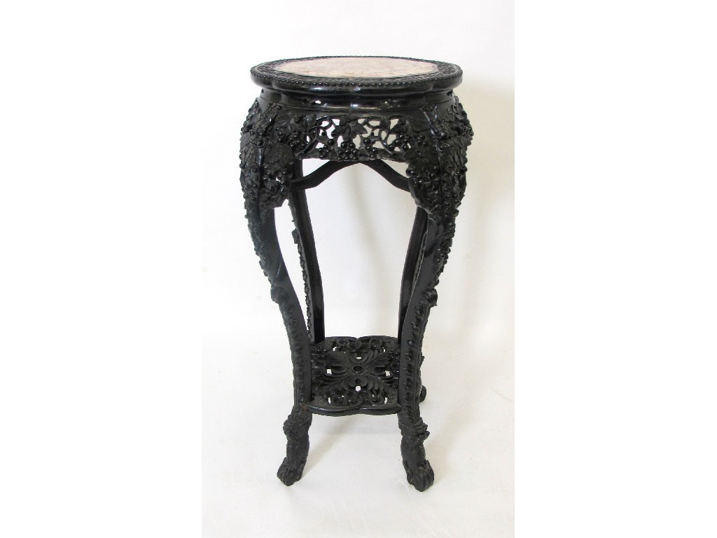 Appraisal: A Chinese hardwood carved plant stand the circular top with