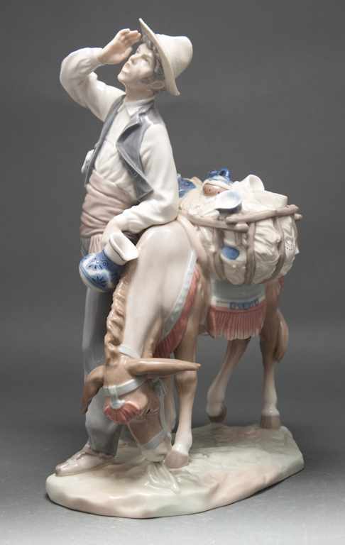 Appraisal: Lladro porcelain figural group of a merchant with donkey blue