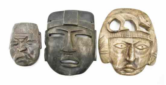 Appraisal: A Group of Seven Olmec Style Carved Stone Masks depicted