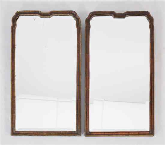 Appraisal: A pair of early th century walnut framed wall mirrors