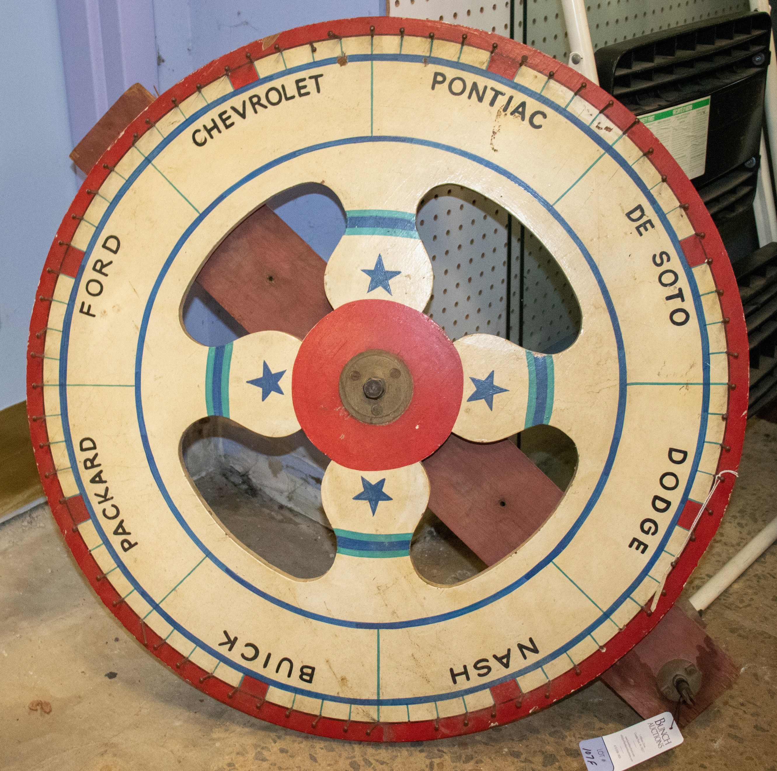 Appraisal: Painted spinning wood game wheel car brands dia