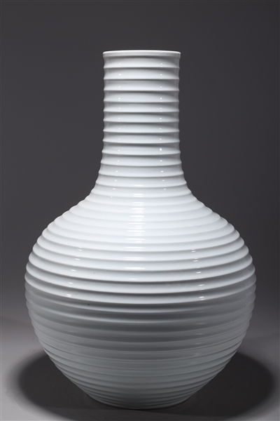 Appraisal: Chinese white glazed bottle vase with ribbed design to body