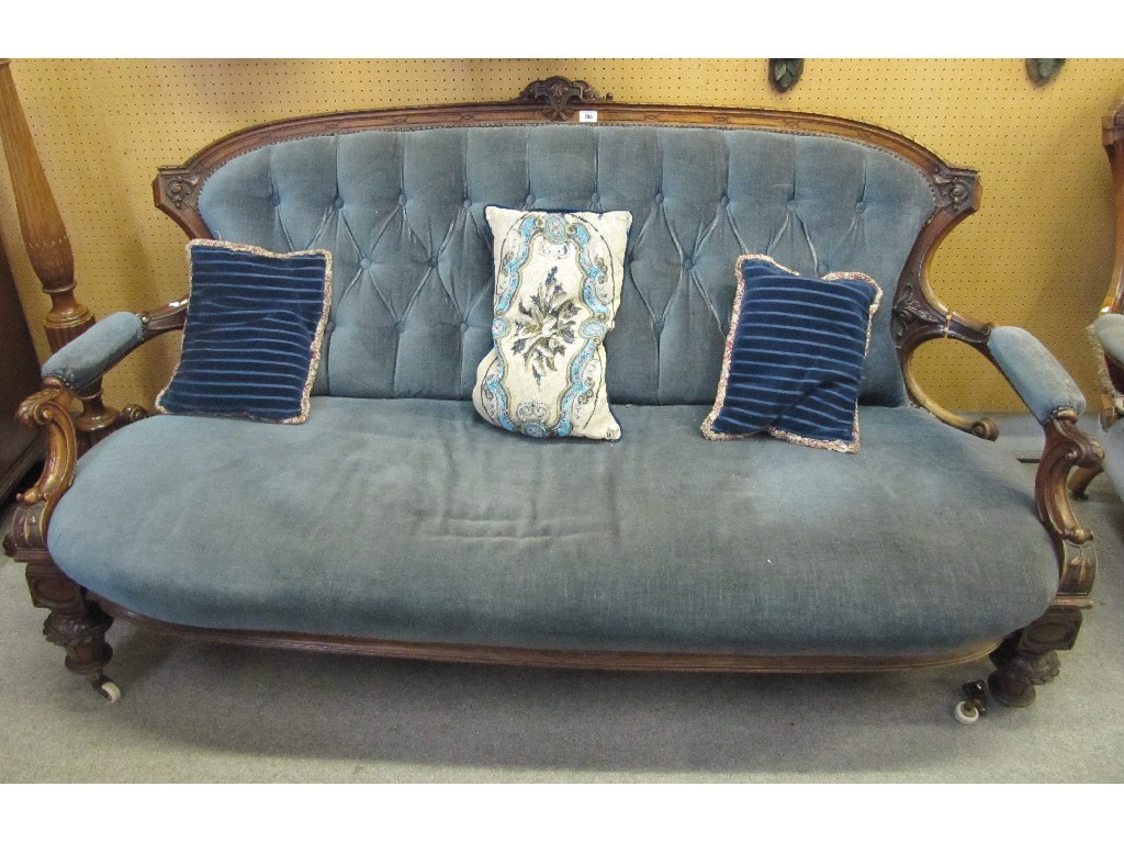 Appraisal: Victorian mahogany parlour settee with matching armchair upholstered in blue