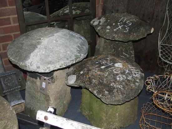 Appraisal: A GROUP OF THREE COTSWOLD LIMESTONE STADDLE STONES largest high