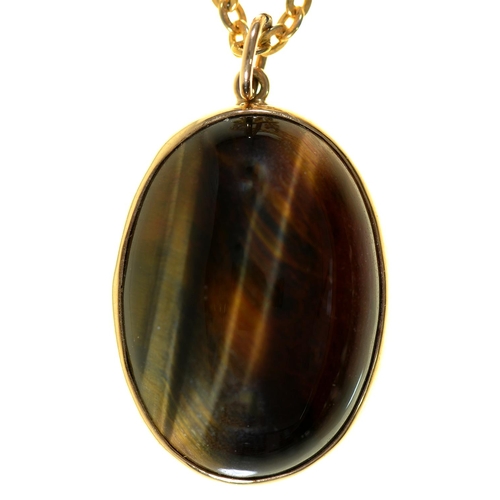 Appraisal: A tiger's eye pendant in ct gold mm London and