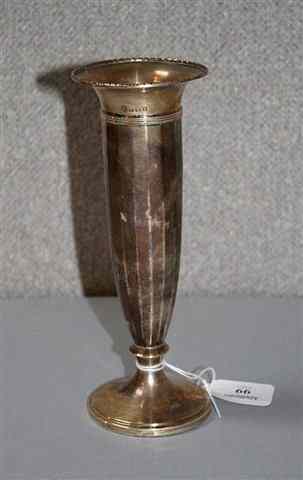 Appraisal: A SILVER TRUMPET VASE with fluted sides and standing on