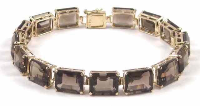 Appraisal: SMOKY QUARTZ AND YELLOW GOLD BRACELET - '' in length