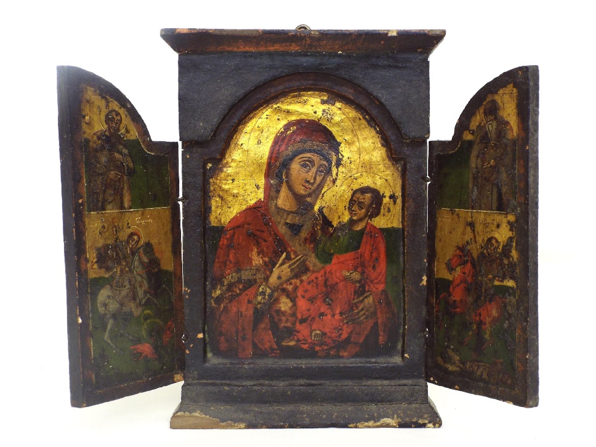 Appraisal: Relegious wooden triptych icon the arched panels opening to reveal