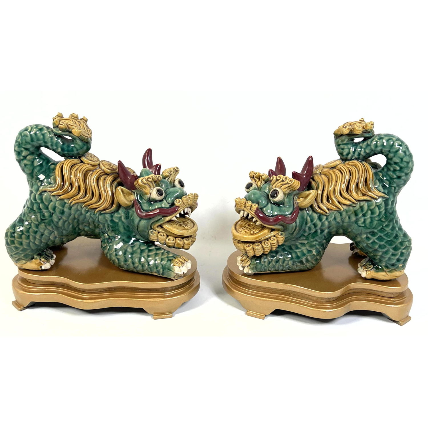 Appraisal: Pair Chinese Porcelain Foo Dog Figures with wood Stands Dimensions