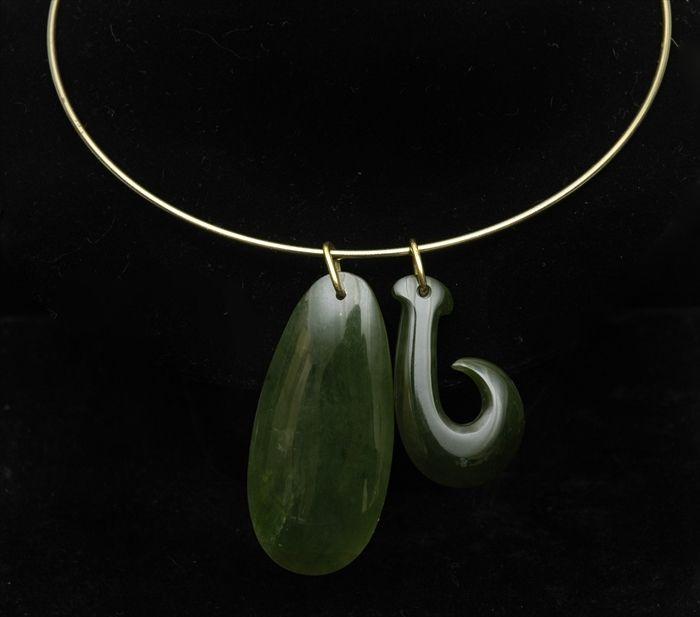 Appraisal: Two Interchangeable Carved Jade Pendants Together with gold wire choker