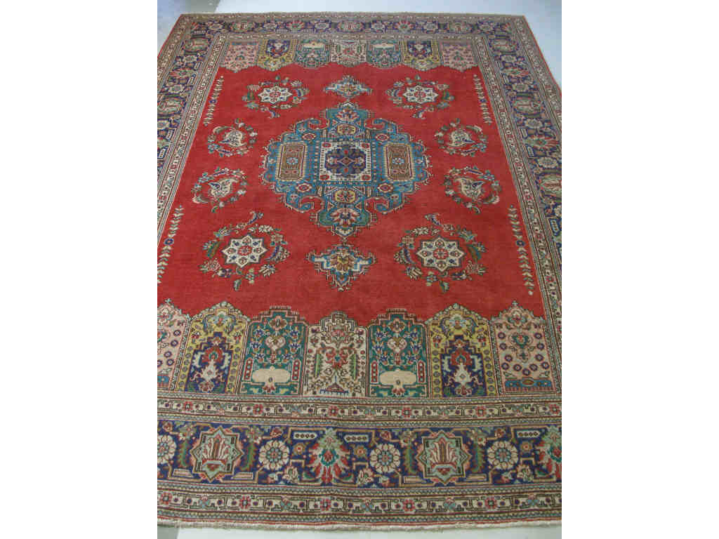 Appraisal: Persian Room Size Rug contemporary Tabriz medallion design rich red