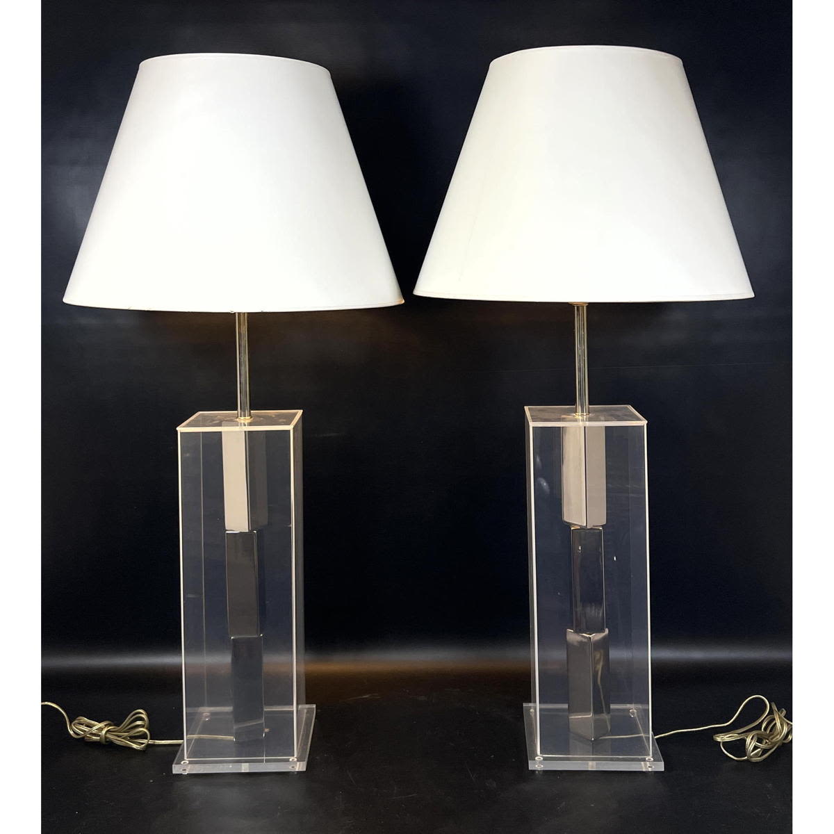 Appraisal: Pr Modernist Lucite Hollow Column Table Lamps Chrome interior accents