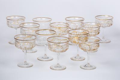 Appraisal: A set of twelve engraved and gilt champagne coupes