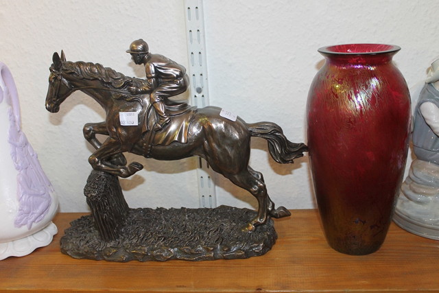 Appraisal: A SPANISH CERAMIC FIGURE of a seated young man together