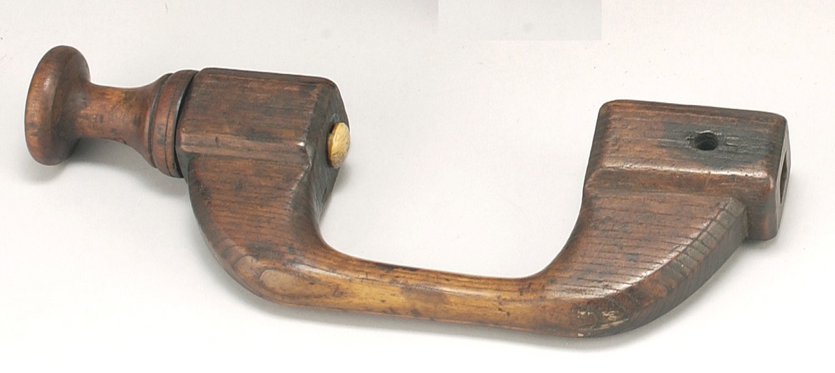 Appraisal: EARLY WOODEN BIT BRACE In chestnut with turned beech knob