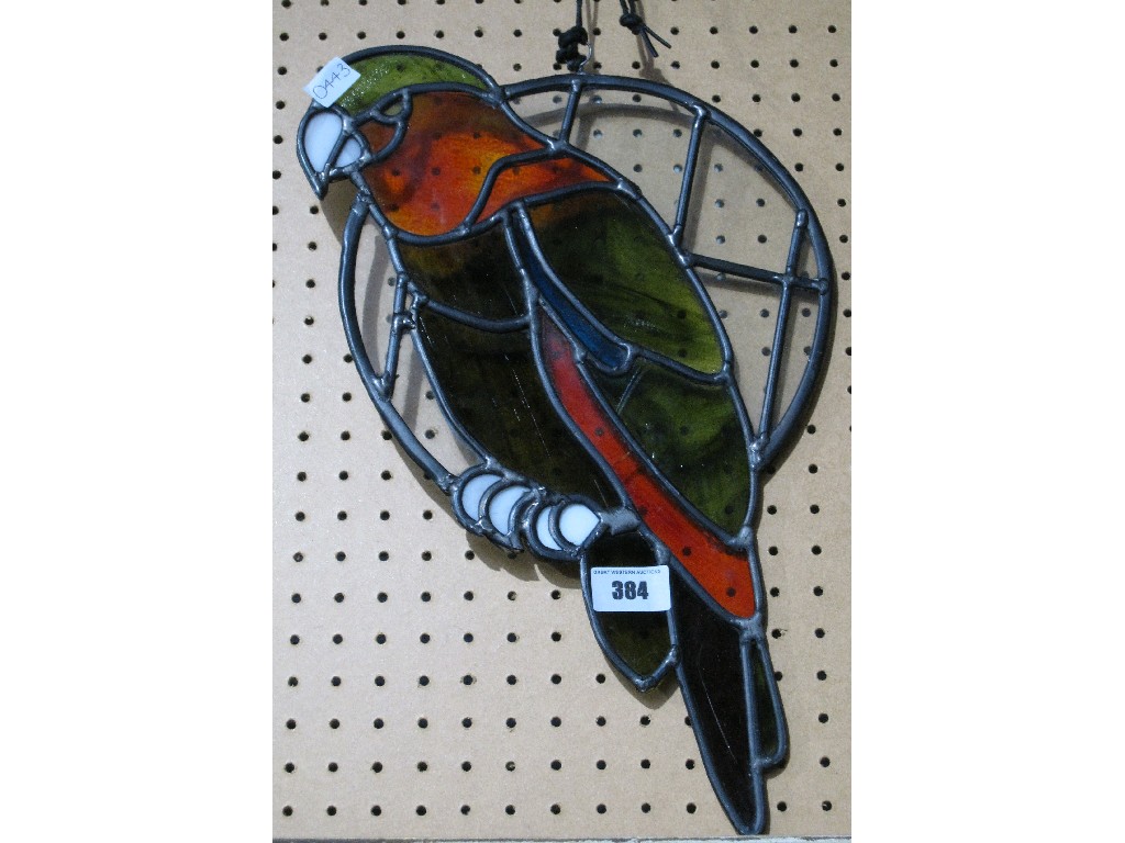 Appraisal: Leaded and stained glass panel modelled as a parrot