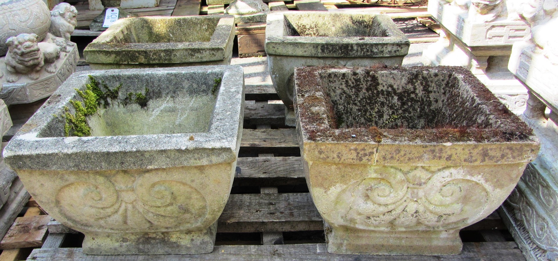 Appraisal: A set of four reconstituted stone planters of tapering square