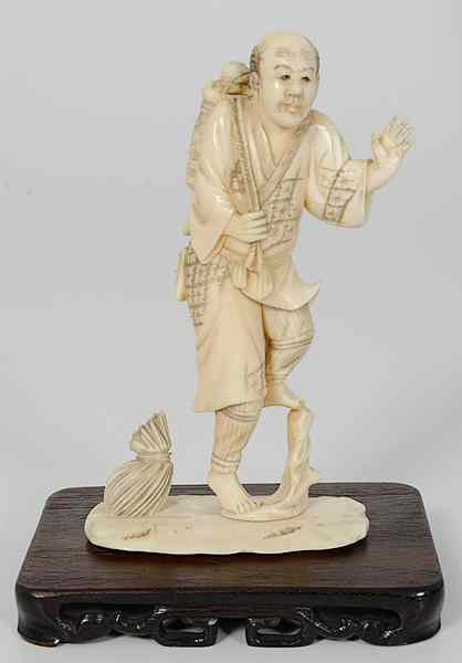 Appraisal: Japanese Carved Ivory Okimono Figure Japan a carved ivory figure