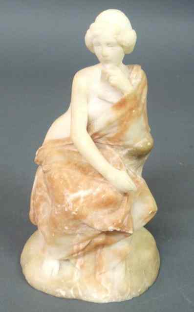 Appraisal: Carved marble statue of a seated and classically robed woman