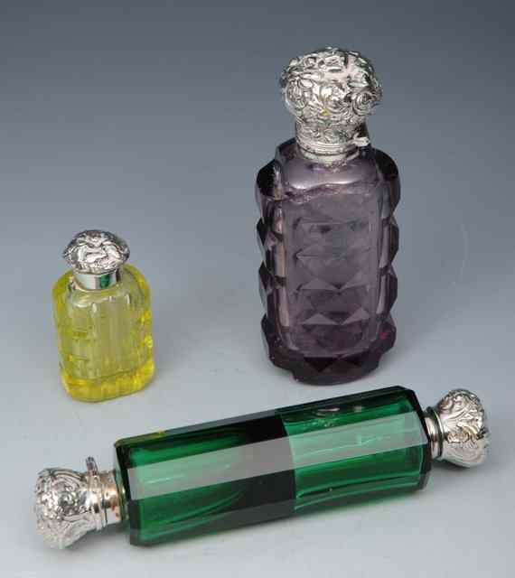 Appraisal: A VICTORIAN AMETHYST GLASS SCENT BOTTLE with silver embossed stopper