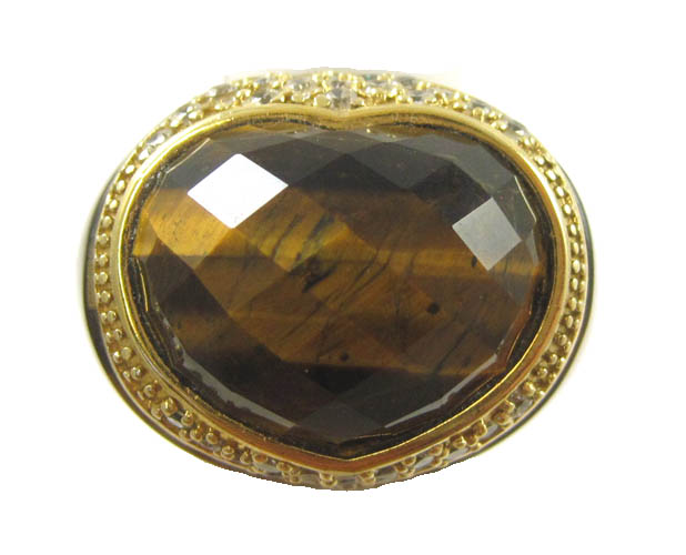 Appraisal: ANGELIQUE DE PARIS TIGER'S EYE RING with a round-cut white