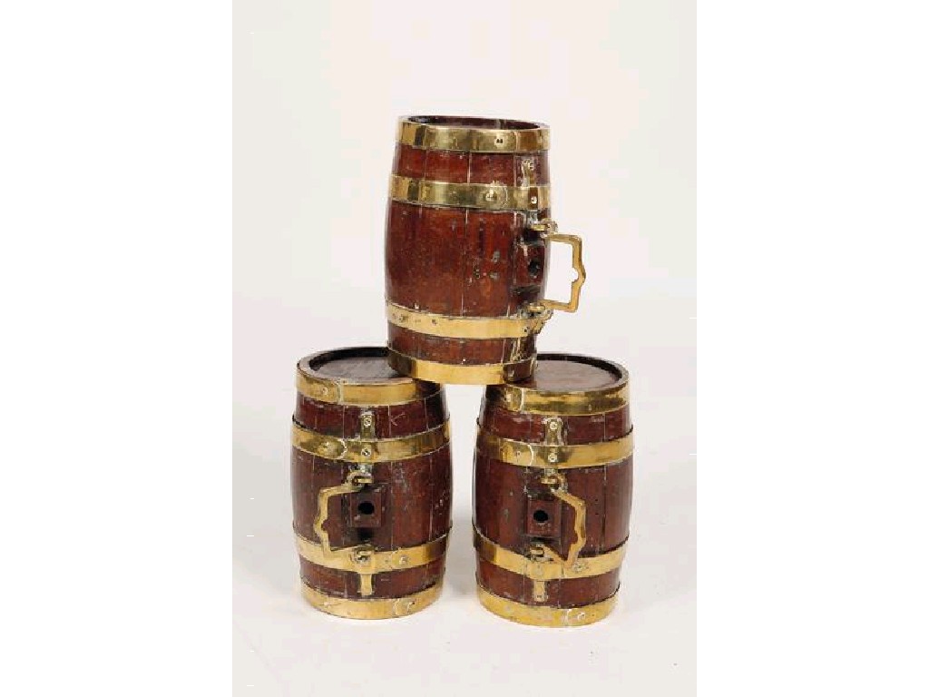 Appraisal: A SET OF THREE BRASS BOUND SPIRIT BARRELS of coopered