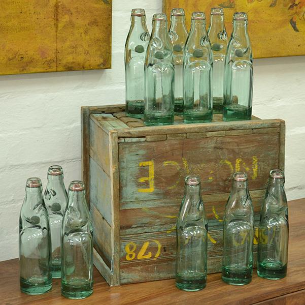 Appraisal: INDUSTRIAL WOODEN CRATE CONTAINING ONE DOZEN GLASS BOTTLES INDUSTRIAL WOODEN