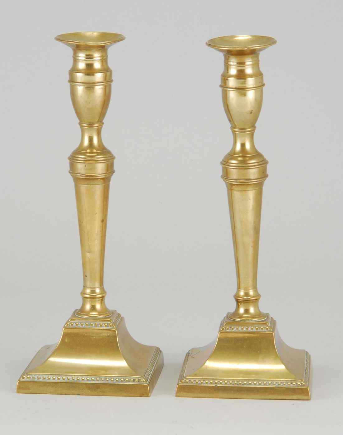 Appraisal: PAIR OF ANTIQUE AMERICAN FEDERAL BRASS CANDLESTICKSLate th CenturyFlared bobeches