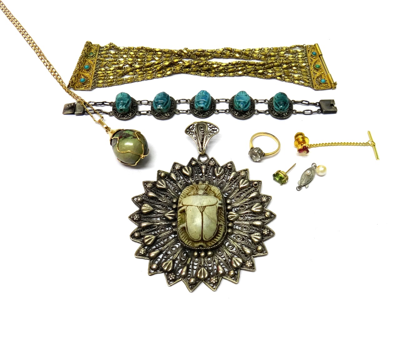 Appraisal: A filigree pendant mounted with a ceramic scarab at the