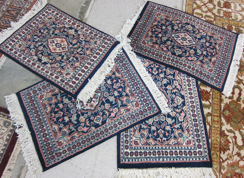 Appraisal: A SET OF FOUR ORIENTAL MATS Indo-Persian matching floral and